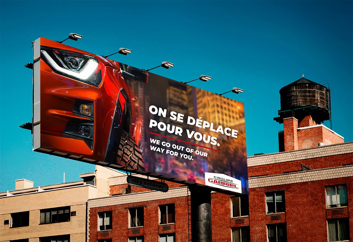The Groupe Gabriel roadside billboard above a Montréal rooftop.