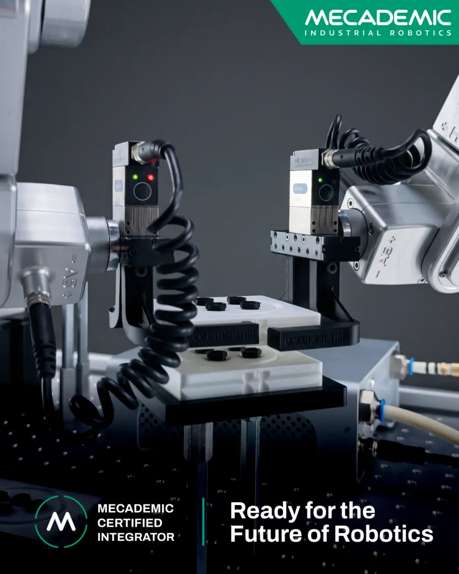 Certified Integrator — two robots in a precision cell.
