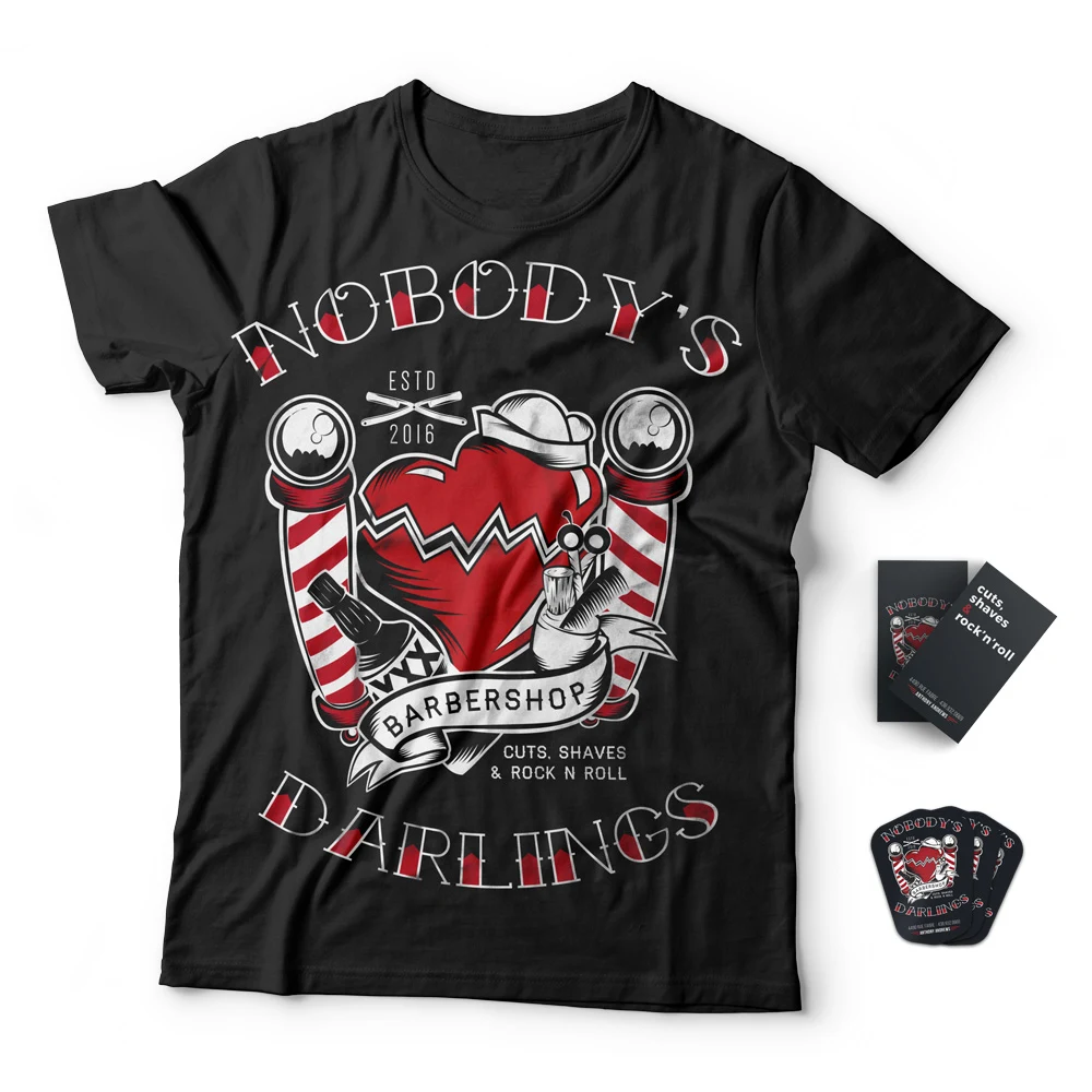 The Nobody's Darlings crest screened on a black tee.