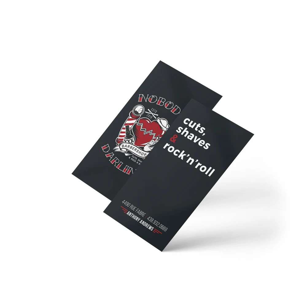 Business cards, both faces — the crest on one side, cuts, shaves and rock'n'roll with contact details on the other.